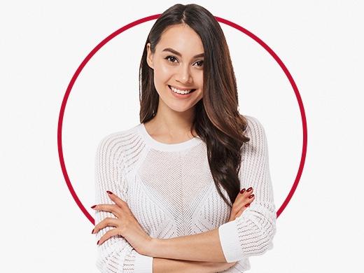 Smiling woman in white sweater happy after Canesten ringworm treatment